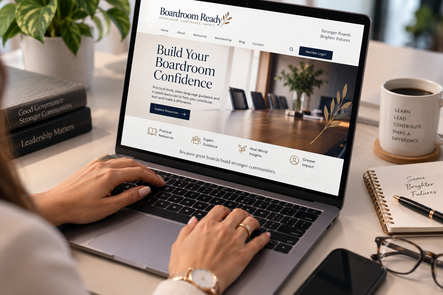 Boardroom Ready website displayed on a laptop with hands typing